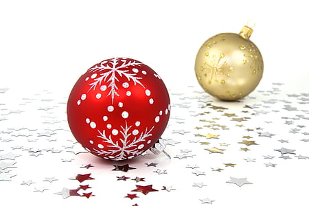 two gold-colored and red baubles