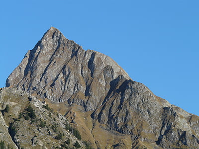 rock mountain under blue sky