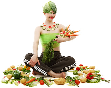 women holding carrots while surrounded by vegetables
