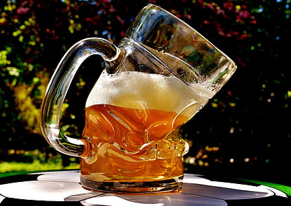 clear glass beer mug filled with beer