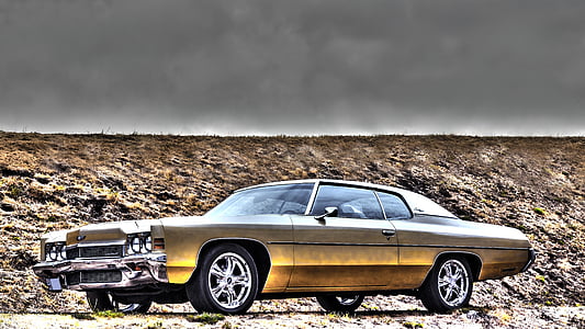 gold-colored coupe