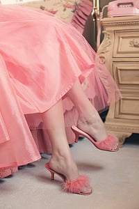 person wearing pink tulle gown and pink fur heeled slide sandals