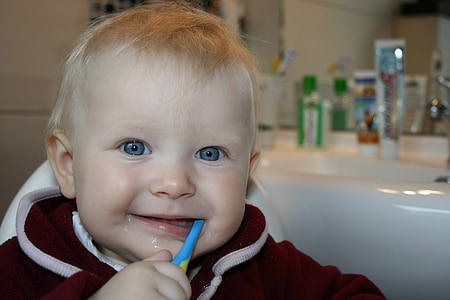 toddler brushing his teeth