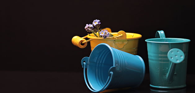 two assorted-color buckets