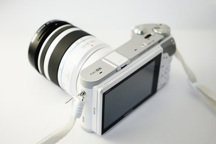 white and black point-and-shoot camera