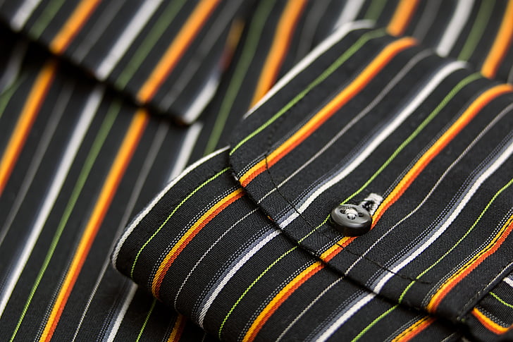 folded white and black striped textile