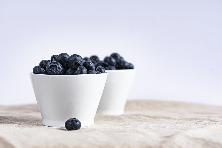 black berries in white ceramic bowl