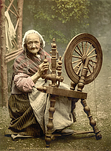 woman sitting holding holding spinning wheel photo