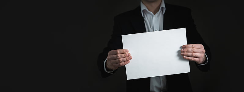 person holding white blank paper