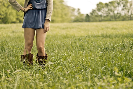 woman standing on grass field