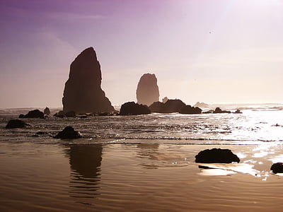 rock formation near seashore at daytime