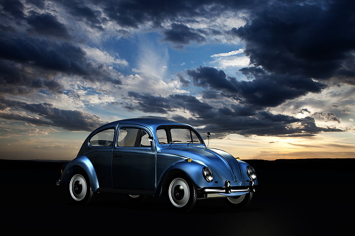 photo of blue new beetle under sky