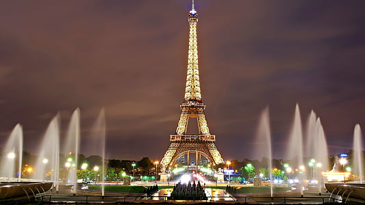 photo of Eiffel Tower, Paris with water fountains during night time