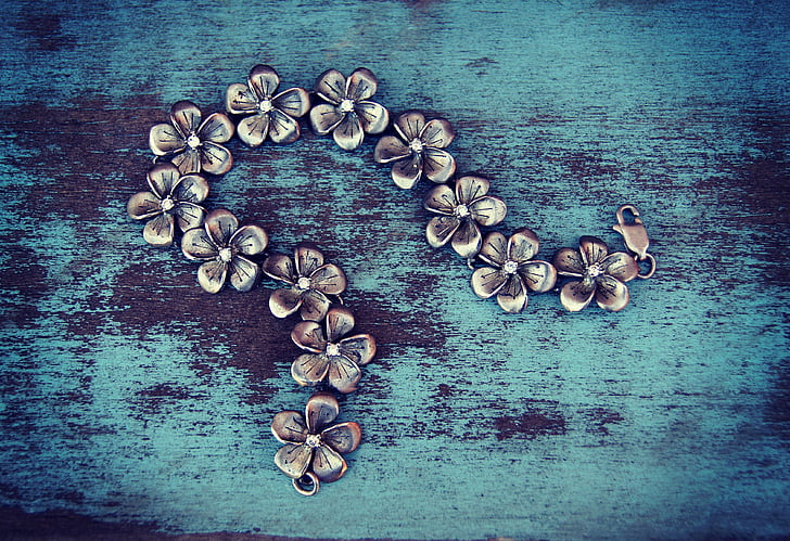 silver-colored floral chain bracelet