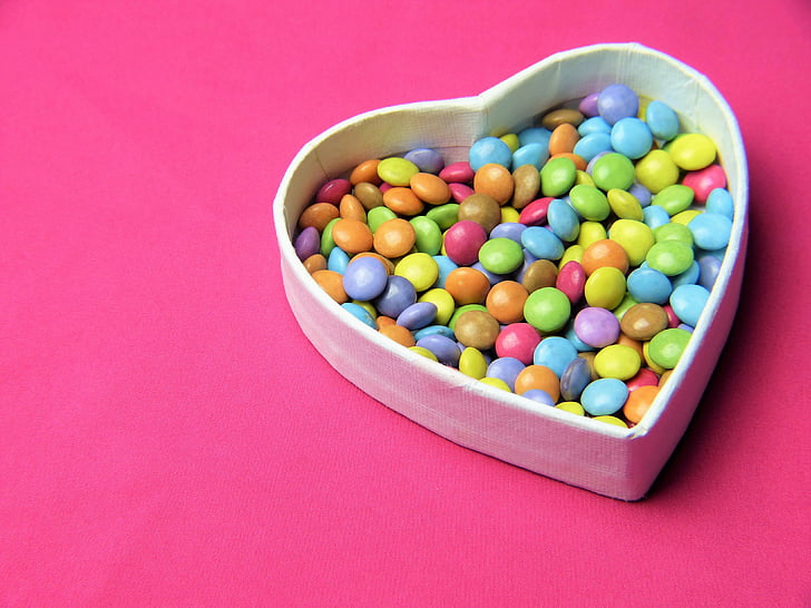 assorted-color candies in heart-shaped box