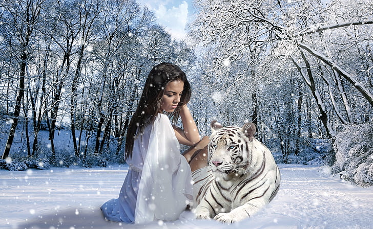 woman seats beside Tiger during snow season
