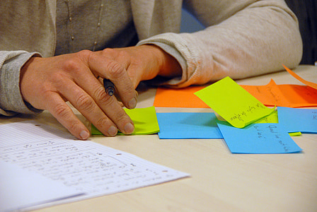 person with assorted-color sticky notes