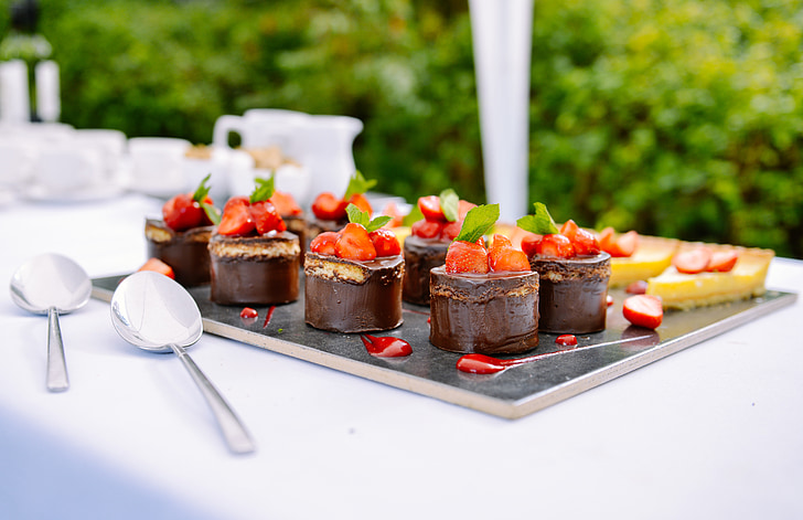 chocolate cakes topped with strawberries