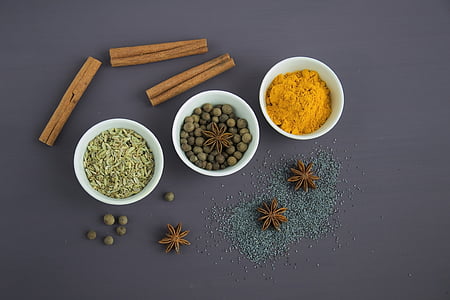 assorted spices on white bowls