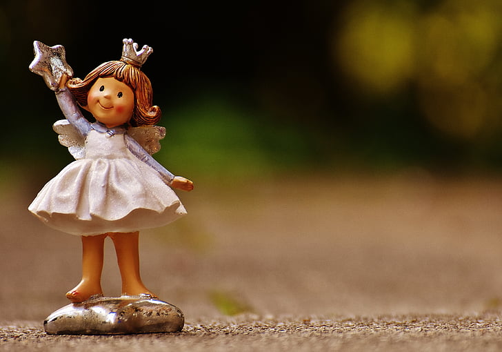 focused photo of girl ceramic figurine