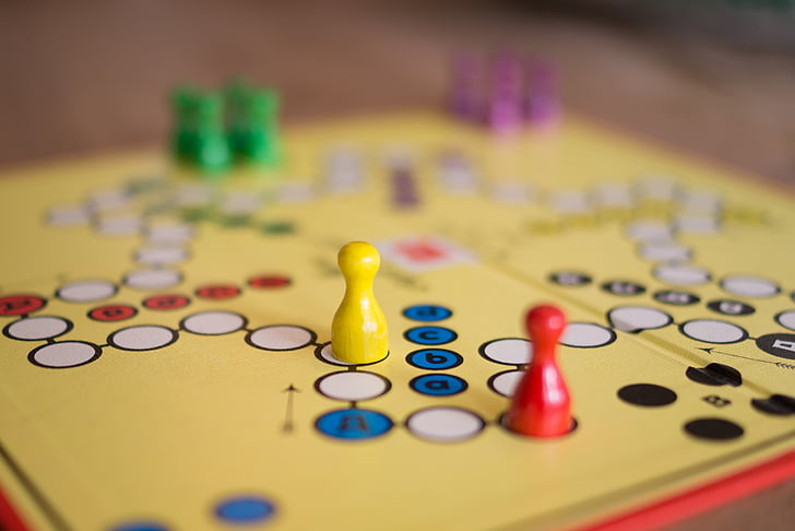 selective focus photographed of yellow game board