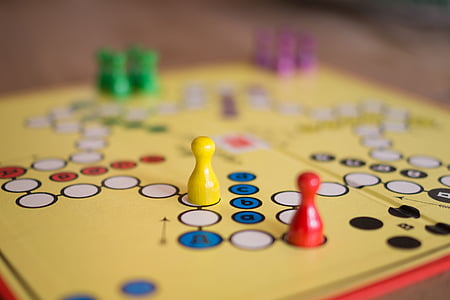 selective focus photographed of yellow game board