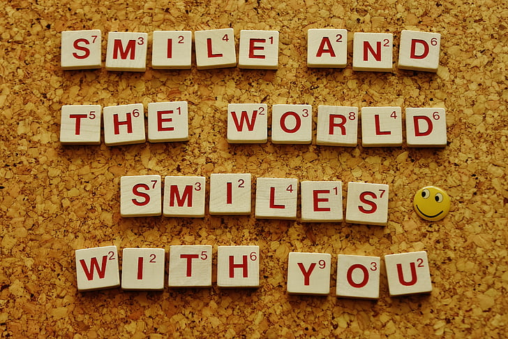 smile and the world smiles with you scrabble piece saying