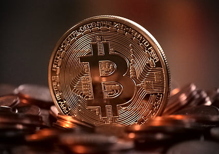 round gold-colored Bitcoin