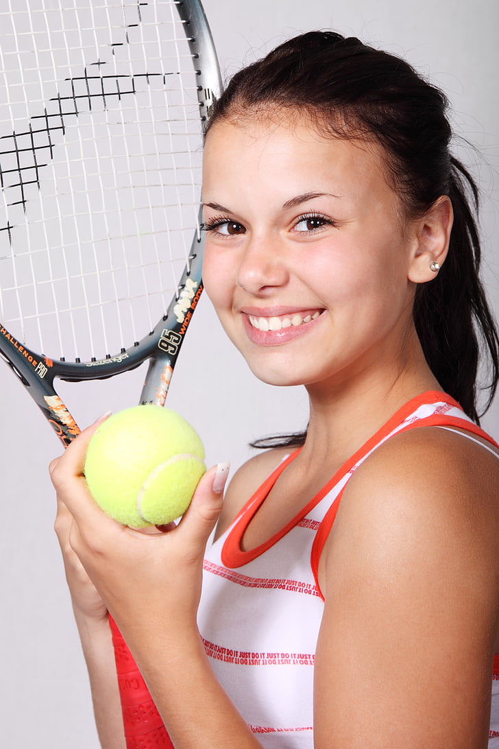 girl holding tennis racket