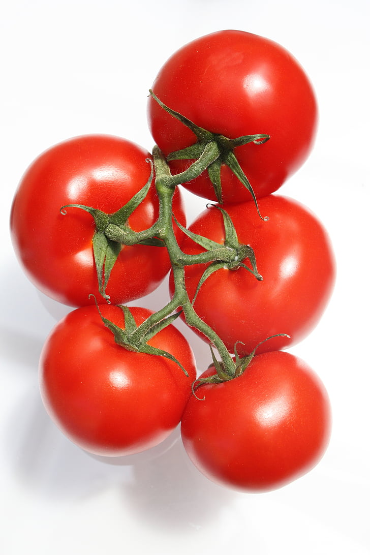 closeup photo of five red tomatoes