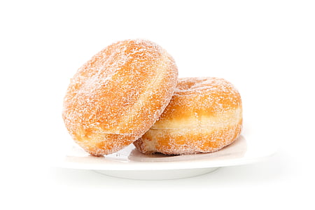 two doughnuts with sugar in saucer