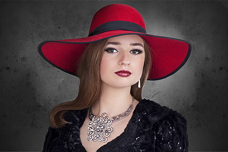 woman wearing black dress and red hat