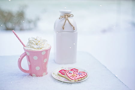 white ceramic jar near pink ceramic mug