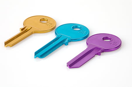 three gold, blue, and purple keys