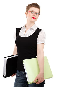 woman wearing black tank top and white button-up shirt holding green folder