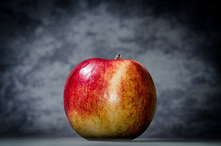 red apple with gray background