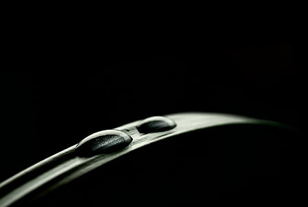 water droplet on leaf inside dark room
