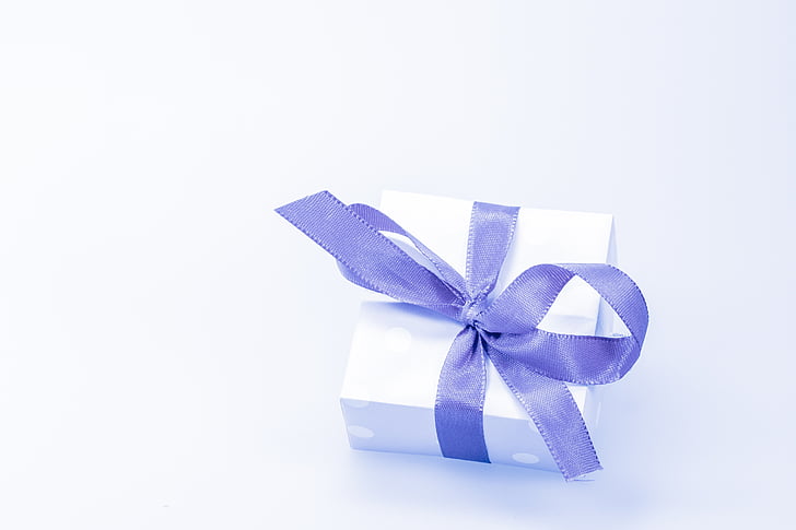 white gift box with blue bow
