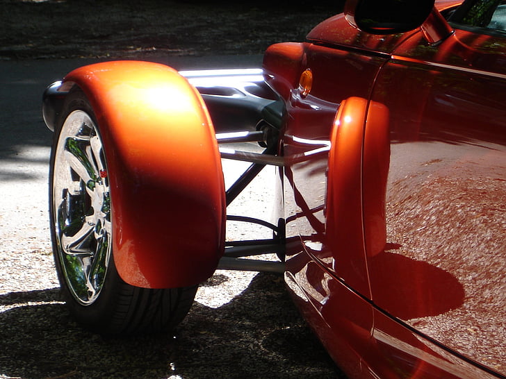 orange car with black tire