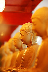 white ceramic buddha in macroshot photography