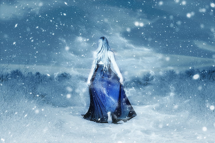 Royalty-Free photo: Woman in blue dress surrounded by snowy trees photo ...