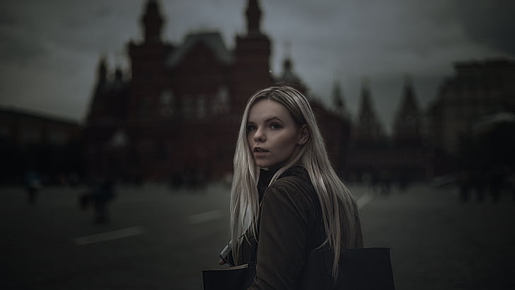 woman with cathedral behind