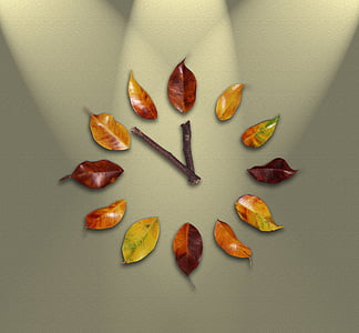 brown and green leaf wall clock at 12:52