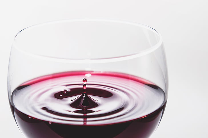 red wine in wineglass closeup photo