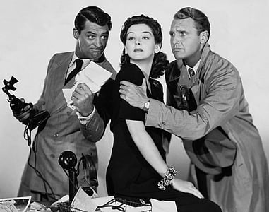 grayscale photo of woman between two men