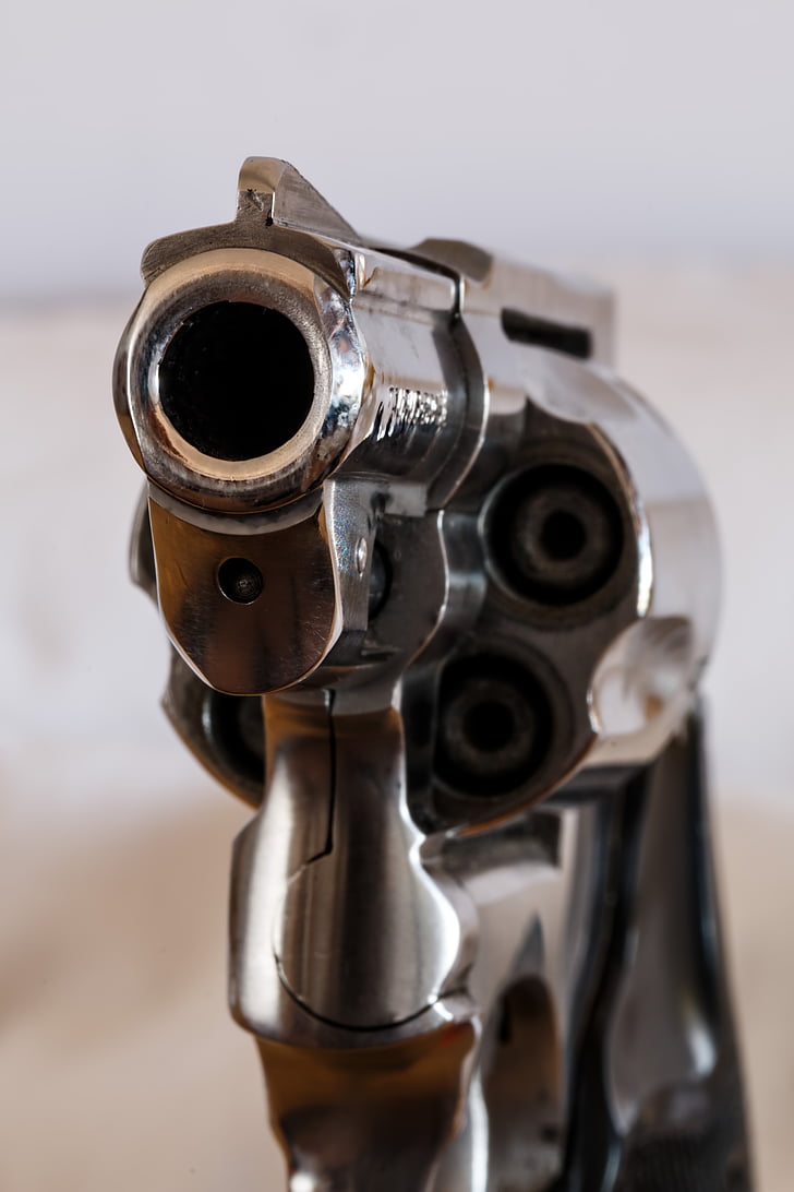 close up photo of gray revolver