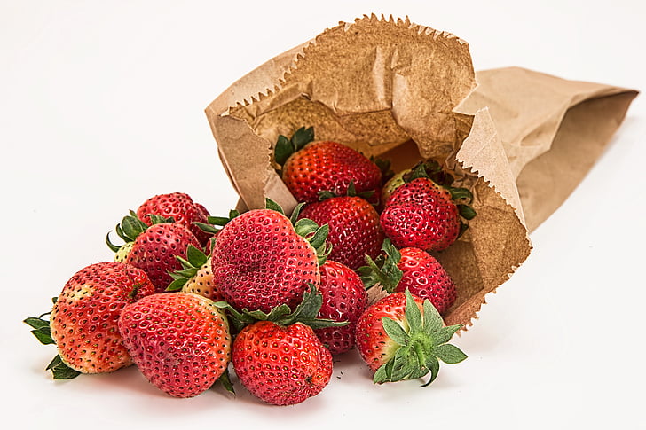 strawberries and brown paper bag