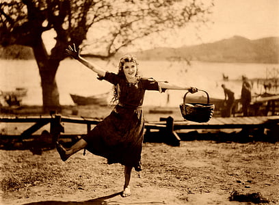sepia photography of girl in dress holding basket