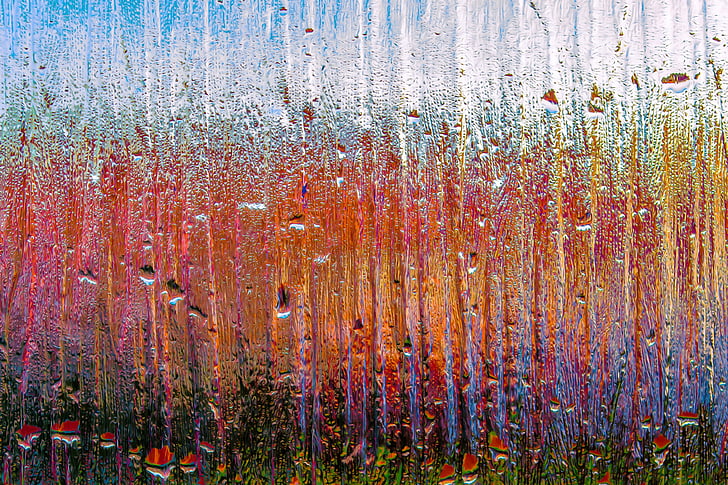 multicolored photo of a frosted glass with droplets