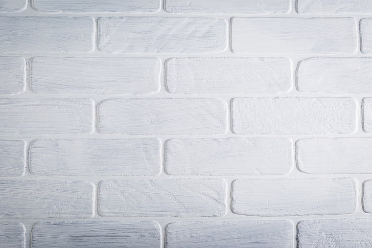 white brick wall in close-up photography